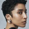 Silver earrings and a black dress